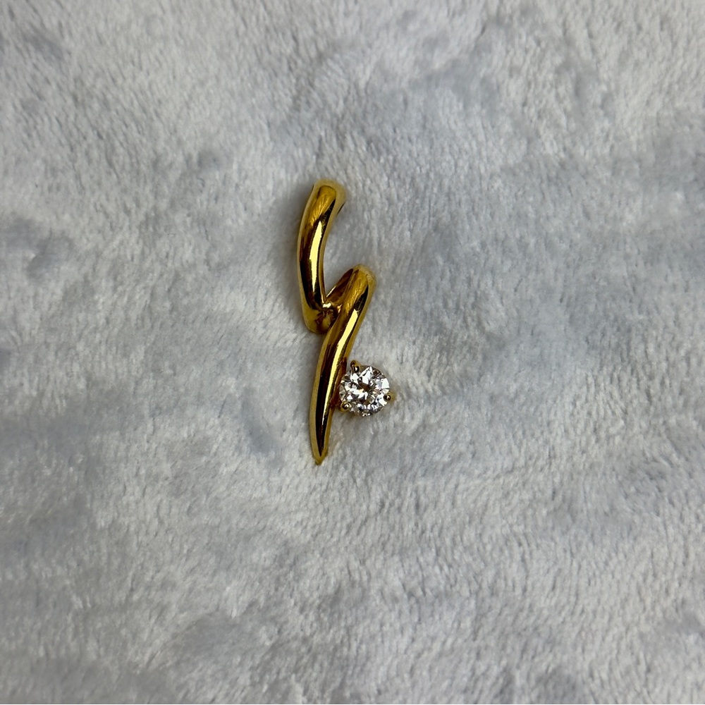 Gold tone squiggle enhancer Pendant with CZ